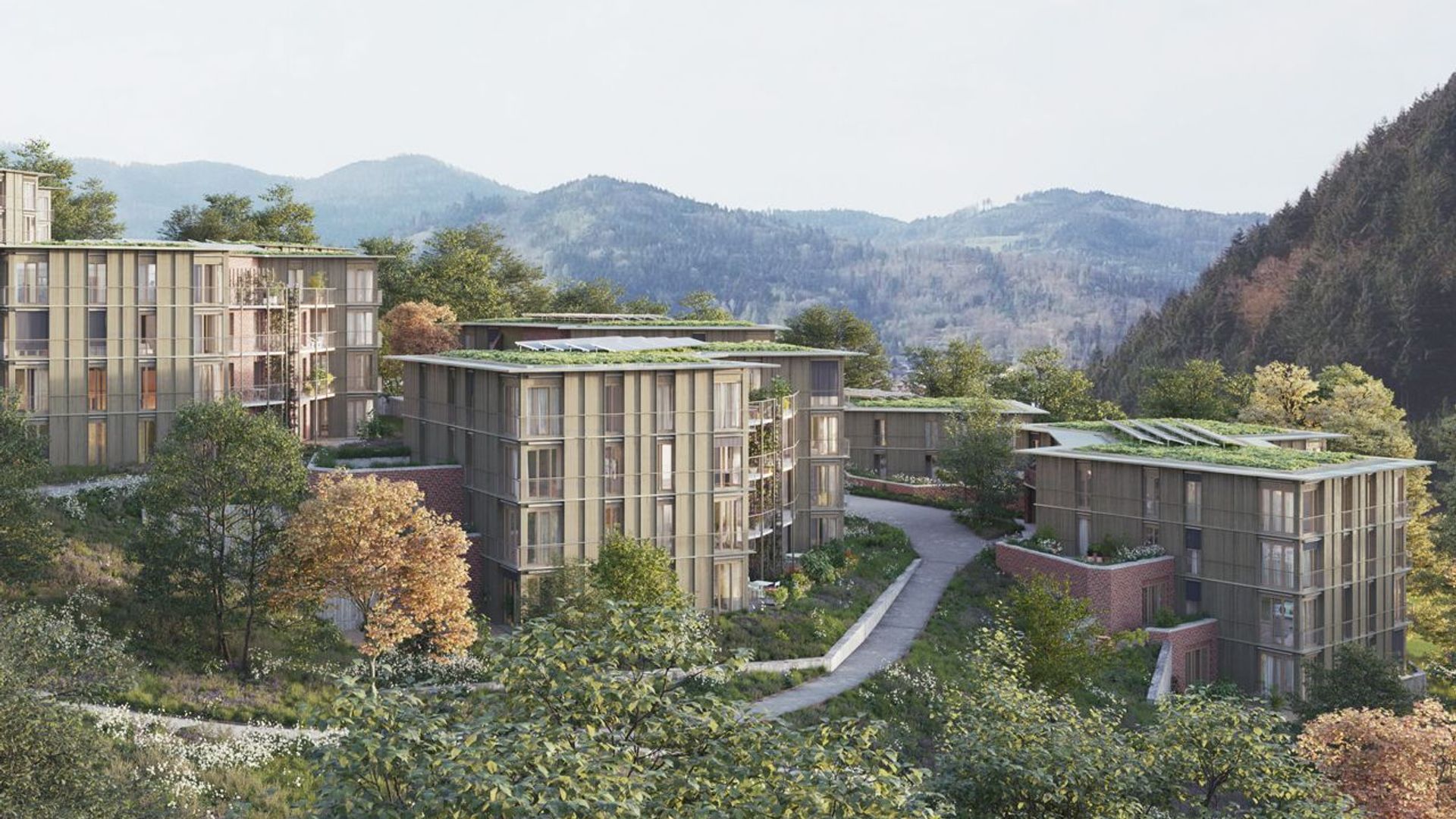 The facade and appearance of the multi-family homes in the Sonnhalde project in Waldkirch are matched with a vertical wooden cladding of the forest structure